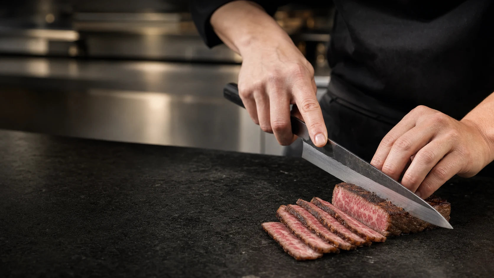 Chef slicing Wagyu for restaurant service